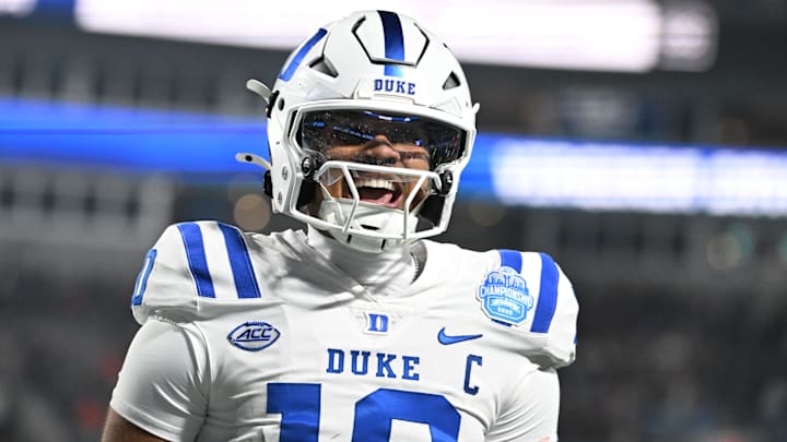 Duke quarterback Darian Mensah (10) celebrates after the Blue Devils score a TD during the ACC Championship game