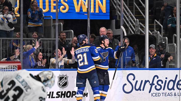 Mar 26, 2026; St. Louis, Missouri, USA; St. Louis Blues left wing Dylan Holloway (81) is congratulated by St. Louis Blues right wing Jimmy Snuggerud (21) after scoring the game winning goal against the San Jose Sharks at Enterprise Center. Mandatory Credit: Joe Puetz-Imagn Images