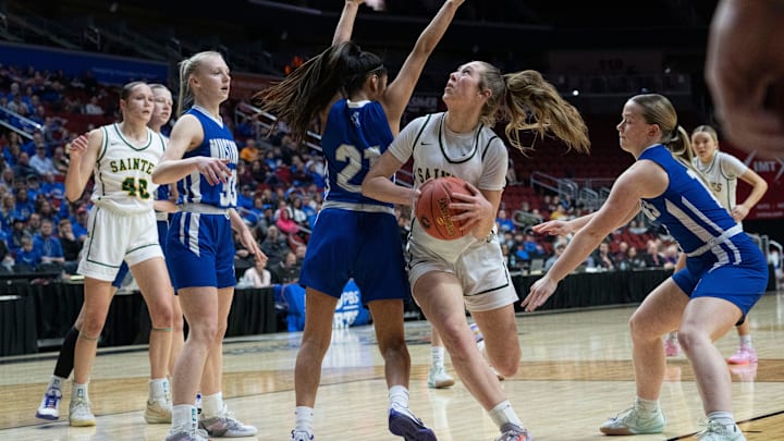 Council Bluffs St. Albert's Payton Johnsen drives to the basket against Newell-Fonda's Mareni Brabec during the 1A IGHSAU state basketball championship at Wells Fargo Arena on Saturday, March 8, 2025, in Des Moines.