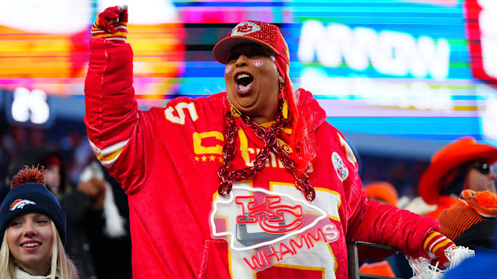 Jan 5, 2025; Denver, Colorado, USA; Kansas City Chiefs fan cheers during the fourth quarter against the Denver Broncos at Empower Field at Mile High. Mandatory Credit: Ron Chenoy-Imagn Images