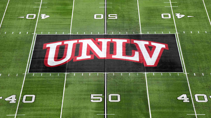 The UNLV Rebels logo at midfield during the Mountain West Championship at Allegiant Stadium. Mandatory Credit: Kirby Lee-Imagn Images The UNLV Rebels logo at midfield during the Mountain West Championship at Allegiant Stadium. Mandatory Credit: Kirby Lee-Imagn Images