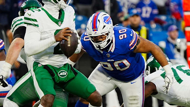 Buffalo Bills defensive tackle DeWayne Carter (90) heads towards New York Jets quarterback Tyrod Taylor (2) during second half action at the Bills home game against the New York Jets at Highmark Stadium in Orchard Park on Dec. 29, 2024. Buffalo Bills defensive tackle DeWayne Carter (90) heads towards New York Jets quarterback Tyrod Taylor (2) during second half action at the Bills home game against the New York Jets at Highmark Stadium in Orchard Park on Dec. 29, 2024.