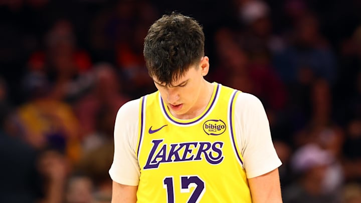 Oct 14, 2025; Phoenix, Arizona, USA; Los Angeles Lakers forward Jake LaRavia (12) reacts against the Phoenix Suns during an NBA preseason game at Mortgage Matchup Center. Mandatory Credit: Mark J. Rebilas-Imagn Images

