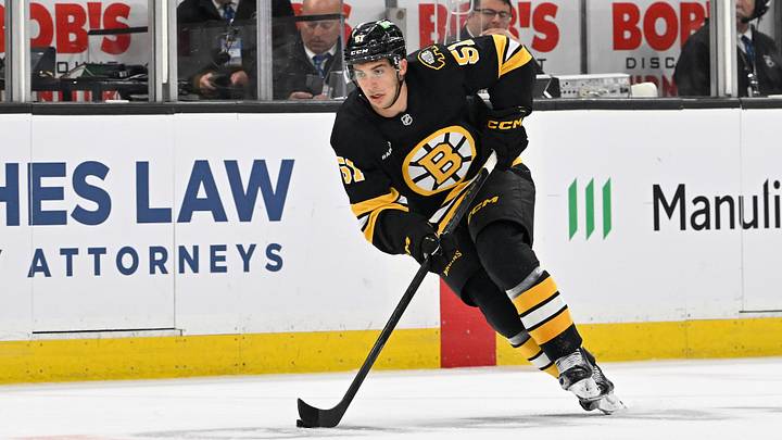 Sep 29, 2025; Boston, Massachusetts, USA;  Boston Bruins center Matthew Poitras (51) carries the puck through the neutral zone during the first period against the Philadelphia Flyers at TD Garden. Mandatory Credit: Eric Canha-Imagn Images
