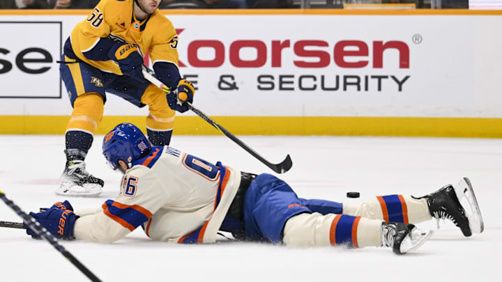 Jan 13, 2026; Nashville, Tennessee, USA;  Edmonton Oilers defenseman Jake Walman (96) blocks the shot of Nashville Predators left wing Michael Bunting (58) during the first period at Bridgestone Arena. Mandatory Credit: Steve Roberts-Imagn Images