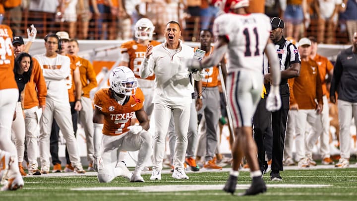 Oct 19, 2024; Austin, Texas, USA; Texas Longhorns head coach Steve Sarkisian and corner back Jahdae Barron (7) react after a pass interference call in the third quarter against the Georgia Bulldogs at Darrell K Royal-Texas Memorial Stadium. Mandatory Credit: Brett Patzke-Imagn Images