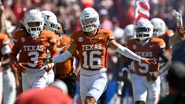 Texas Longhorns defensive back Michael Taaffe leads the team on to the field against the Oklahoma Sooners