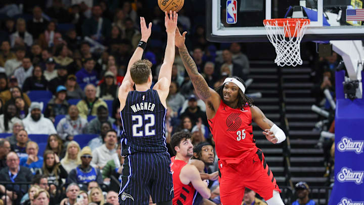 Jan 23, 2025; Orlando, Florida, USA; Orlando Magic forward Franz Wagner (22) shoots against Portland Trail Blazers center Robert Williams III (35) during the second half at Kia Center. Mandatory Credit: Mike Watters-Imagn Images