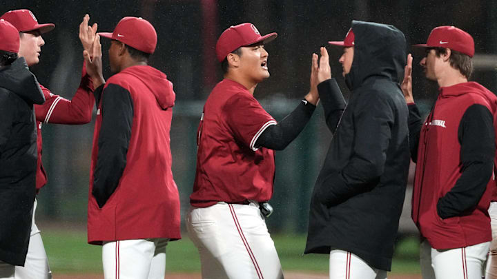 Mar 1, 2025; Stanford, CA, USA; Stanford Cardinal first baseman Rintaro Sasaki (center) celebrates with teammates after defeating the Xavier Musketeers at Sunken Diamond. Mandatory Credit: Darren Yamashita-Imagn Images