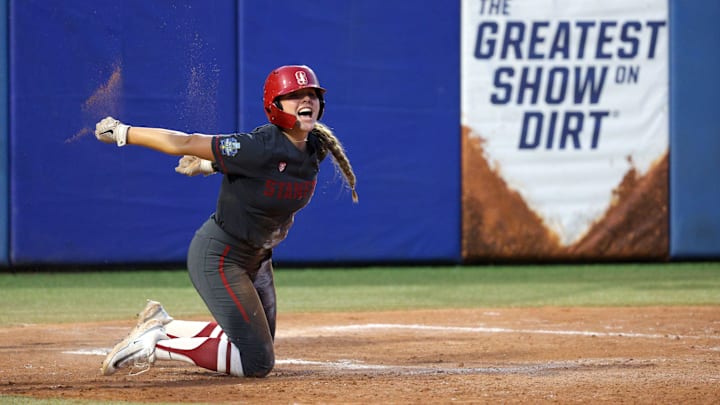Stanford's Taryn Kern (99) celebrates after scoring a run in the third inning of a Women's College World Series softball game between the Stanford Cardinal and the UCLA Bruins at Devon Park in Oklahoma City, Sunday, June 2, 2024. Stanford won 3-1. Stanford's Taryn Kern (99) celebrates after scoring a run in the third inning of a Women's College World Series softball game between the Stanford Cardinal and the UCLA Bruins at Devon Park in Oklahoma City, Sunday, June 2, 2024. Stanford won 3-1.