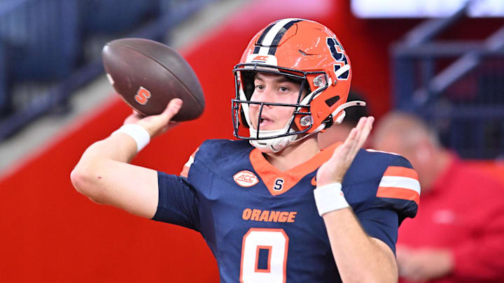 Sep 12, 2025; Syracuse, New York, USA; Syracuse Orange quarterback Steve Angeli (9) warms up before a game against the Colgate Raiders at JMA Wireless Dome. Mandatory Credit: Mark Konezny-Imagn Images