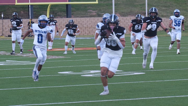 Senior wide receiver Kaiden Miller of Randall High School breaks for the endzone after securing a pass from senior quarterback Kaison Benton against Estacado Thursday night at Happy State Bank Stadium in Canyon.