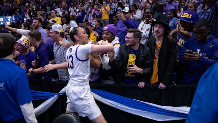 Mar 24, 2024; Baton Rouge, Louisiana, USA;  LSU Lady Tigers guard Last-Tear Poa (13) celebrates with fans after the game against the Middle Tennessee Blue Raiders at Pete Maravich Assembly Center. Mandatory Credit: Stephen Lew-Imagn Images