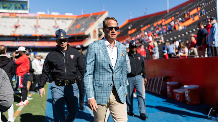Nov 23, 2024; Gainesville, Florida, USA; Mississippi Rebels head coach Lane Kiffin walks off the field before a game against the Florida Gators at Ben Hill Griffin Stadium. Mandatory Credit: Matt Pendleton-Imagn Images Nov 23, 2024; Gainesville, Florida, USA; Mississippi Rebels head coach Lane Kiffin walks off the field before a game against the Florida Gators at Ben Hill Griffin Stadium. Mandatory Credit: Matt Pendleton-Imagn Images