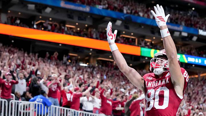 Indiana Hoosiers wide receiver Charlie Becker (80) celebrates after making a catch for a touchdown Friday, Jan. 9, 2026, during the Peach Bowl and semifinal game of the College Football Playoff against the Oregon Ducks at Mercedes-Benz Stadium in Atlanta.