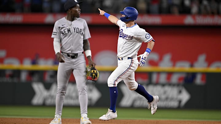 Aug 4, 2025; Arlington, Texas, USA; Texas Rangers designated hitter Josh Jung (6) rounds the bases past New York Yankees second baseman Jazz Chisholm Jr. (13) after Jung hits a game winning home run during the tenth inning at Globe Life Field. Aug 4, 2025; Arlington, Texas, USA; Texas Rangers designated hitter Josh Jung (6) rounds the bases past New York Yankees second baseman Jazz Chisholm Jr. (13) after Jung hits a game winning home run during the tenth inning at Globe Life Field.