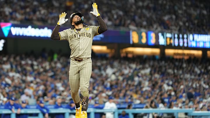Sep 25, 2024; Los Angeles, California, USA; San Diego Padres right fielder Fernando Tatis Jr. (23) celebrates after hitting a solo home run in the fifth inning against the Los Angeles Dodgers at Dodger Stadium. Mandatory Credit: Kirby Lee-Imagn Images Sep 25, 2024; Los Angeles, California, USA; San Diego Padres right fielder Fernando Tatis Jr. (23) celebrates after hitting a solo home run in the fifth inning against the Los Angeles Dodgers at Dodger Stadium. Mandatory Credit: Kirby Lee-Imagn Images