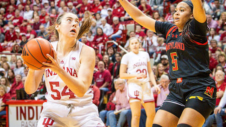 Indiana's Mackenzie Holmes (54) looks to score over Maryland's Brinae Alexander (5) during the first half of the Indiana versus Maryland women's basketball game at Simon Skjodt Assembly Hall on Sunday, March 3, 2024.