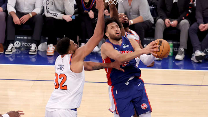 Jan 13, 2025; New York, New York, USA; Detroit Pistons guard Cade Cunningham (2) drives to the basket against New York Knicks center Karl-Anthony Towns (32) and forward Mikal Bridges (25) during the fourth quarter at Madison Square Garden. Mandatory Credit: Brad Penner-Imagn Images Jan 13, 2025; New York, New York, USA; Detroit Pistons guard Cade Cunningham (2) drives to the basket against New York Knicks center Karl-Anthony Towns (32) and forward Mikal Bridges (25) during the fourth quarter at Madison Square Garden. Mandatory Credit: Brad Penner-Imagn Images