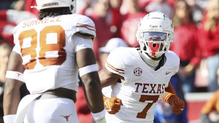 Nov 16, 2024; Fayetteville, Arkansas, USA; Texas Longhorns defensive back Jahdae Barron (7) celebrates after making a play against the Arkansas Razorbacks during the first quarter at Donald W. Reynolds Razorback Stadium. Mandatory Credit: Nelson Chenault-Imagn Images