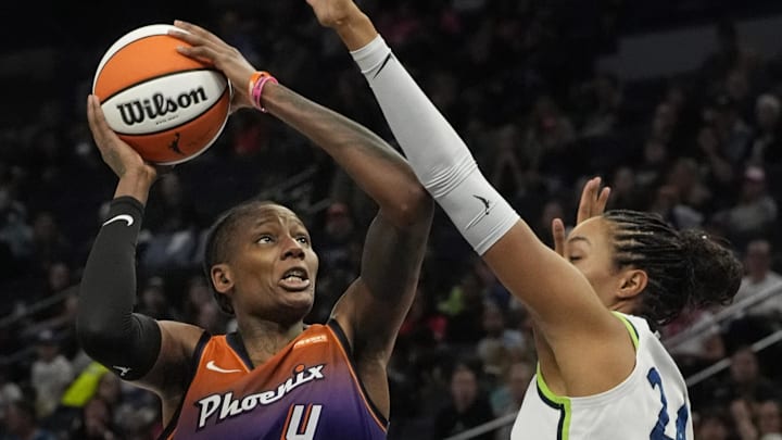 Jul 16, 2025; Minneapolis, Minnesota, USA; Phoenix Mercury forward Natasha Mack (4) shoots against Minnesota Lynx forward Napheesa Collier (24) in the third quarter at Target Center. Mandatory Credit: Bruce Kluckhohn-Imagn Images