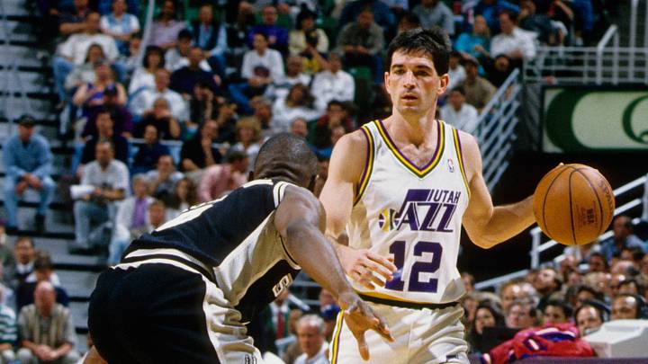 Apr 14, 1994; Salt Lake City, UT, USA; FILE PHOTO; Utah Jazz guard John Stockton (12) is defended by San Antonio Spurs guard Avery Johnson (left) at the Delta Center. Mandatory Credit: USA TODAY Sports Apr 14, 1994; Salt Lake City, UT, USA; FILE PHOTO; Utah Jazz guard John Stockton (12) is defended by San Antonio Spurs guard Avery Johnson (left) at the Delta Center. Mandatory Credit: USA TODAY Sports