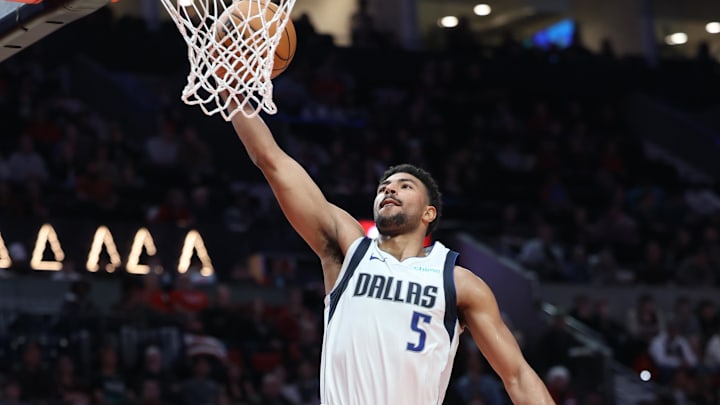 Dec 1, 2024; Portland, Oregon, USA; Dallas Mavericks guard Quentin Grimes (5) shoots the ball over Portland Trail Blazers guard Anfernee Simons (1) in the second half at Moda Center. Mandatory Credit: Jaime Valdez-Imagn Images Dec 1, 2024; Portland, Oregon, USA; Dallas Mavericks guard Quentin Grimes (5) shoots the ball over Portland Trail Blazers guard Anfernee Simons (1) in the second half at Moda Center. Mandatory Credit: Jaime Valdez-Imagn Images