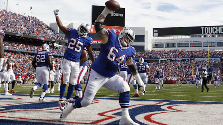 Oct 22, 2017; Orchard Park, NY, USA; Buffalo Bills offensive guard Richie Incognito (64) spikes the ball to celebrate his teams touchdown during the first half against the Tampa Bay Buccaneers at New Era Field