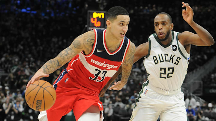 Feb 1, 2022; Milwaukee, Wisconsin, USA;  Washington Wizards forward Kyle Kuzma (33) drives to the basket against Milwaukee Bucks forward Khris Middleton (22) in the second half at Fiserv Forum. Mandatory Credit: Michael McLoone-Imagn Images