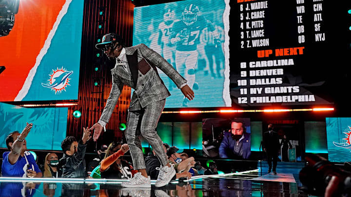 Jaylen Waddle (Alabama) walks on stage after being selected by Miami Dolphins as the number six overall pick in the first round of the 2021 NFL Draft at First Energy Stadium. Jaylen Waddle (Alabama) walks on stage after being selected by Miami Dolphins as the number six overall pick in the first round of the 2021 NFL Draft at First Energy Stadium.