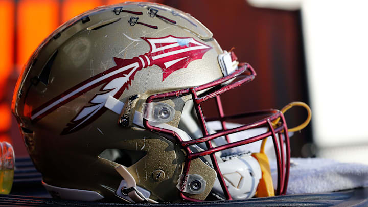 Nov 25, 2017; Gainesville, FL, USA; Florida State Seminoles helmet lays on the field against the Florida Gators during the second half at Ben Hill Griffin Stadium. Mandatory Credit: Kim Klement-Imagn Images Nov 25, 2017; Gainesville, FL, USA; Florida State Seminoles helmet lays on the field against the Florida Gators during the second half at Ben Hill Griffin Stadium. Mandatory Credit: Kim Klement-Imagn Images