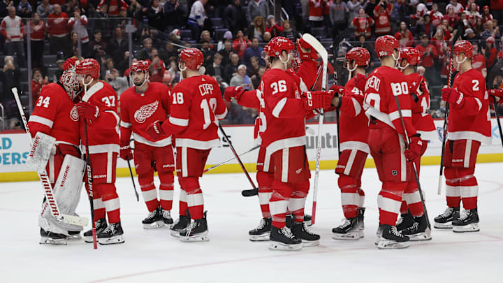 Detroit Red Wings celebrate after defeating the Philadelphia Flyers on home ice. 
