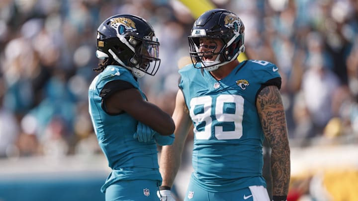 Oct 27, 2024; Jacksonville, Florida, USA; Jacksonville Jaguars wide receiver Brian Thomas Jr. (7) and tight end Luke Farrell (89) celebrate a touchdown against the Green Bay Packers during the third quarter at EverBank Stadium. Mandatory Credit: Morgan Tencza-Imagn Images