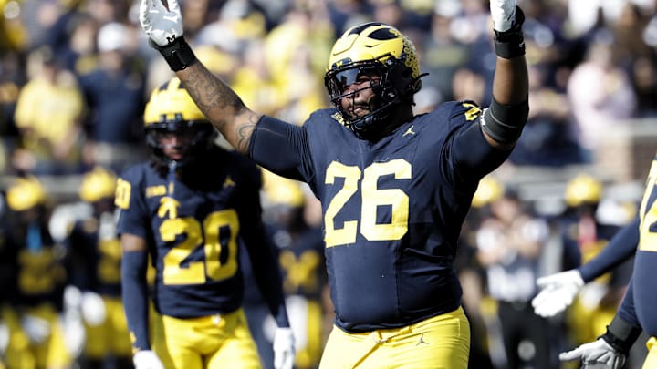 Oct 18, 2025; Ann Arbor, Michigan, USA;  Michigan Wolverines defensive lineman Rayshaun Benny (26) fires up the crowd in the first half against the Michigan Wolverines at Michigan Stadium. Mandatory Credit: Rick Osentoski-Imagn Images