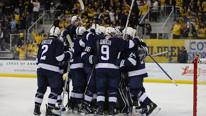 The Penn State Nittany Lions celebrate their win over the Michigan Wolverines in the 2025 Big Ten Hockey Tournament. 