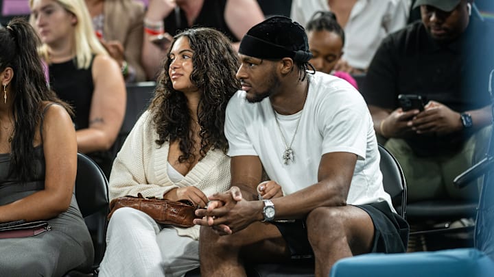 Bronny James and girlfriend Parker Whitfield watch LeBron James and Team USA at the 2024 Paris Olympics. 