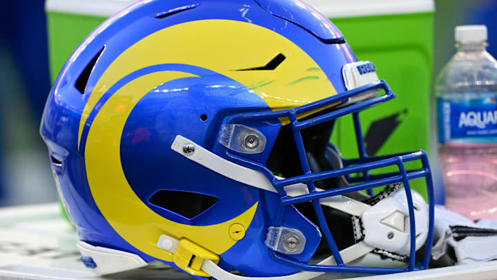 Nov 17, 2024; Foxborough, Massachusetts, USA; A Los Angeles Rams helmet sits on a cooler during the second half against the New England Patriots at Gillette Stadium. Mandatory Credit: Eric Canha-Imagn Images