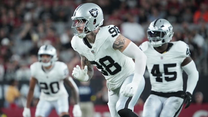 Aug 23, 2025; Glendale, Arizona, USA; Las Vegas Raiders defensive end Maxx Crosby (98) pursues the play against the Arizona Cardinals during the first half at State Farm Stadium. Mandatory Credit: Joe Camporeale-Imagn Images