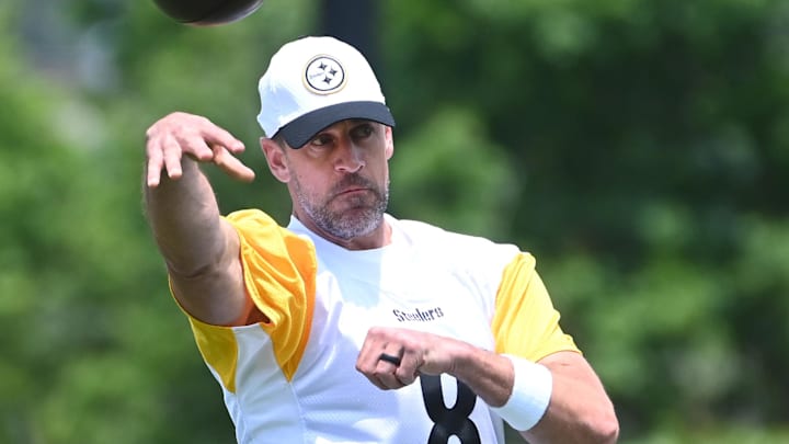 Aaron Rodgers displays the wedding ring on his left hand while throwing a pass at a Steelers practice Aaron Rodgers displays the wedding ring on his left hand while throwing a pass at a Steelers practice