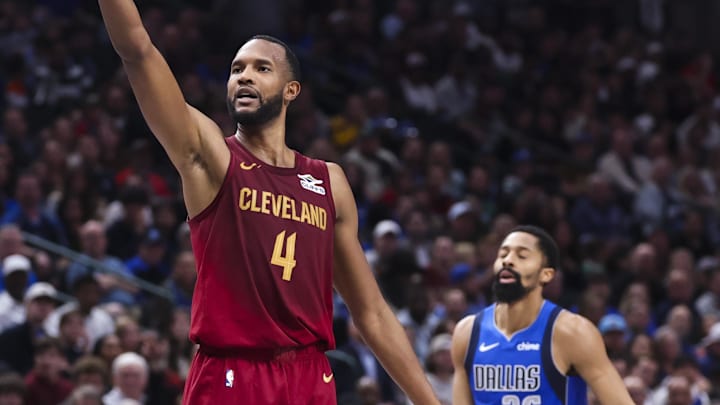 Jan 3, 2025; Dallas, Texas, USA; Cleveland Cavaliers forward Evan Mobley (4) reacts in front of Dallas Mavericks guard Spencer Dinwiddie (26) after shooting during the first half at American Airlines Center. Mandatory Credit: Kevin Jairaj-Imagn Images
