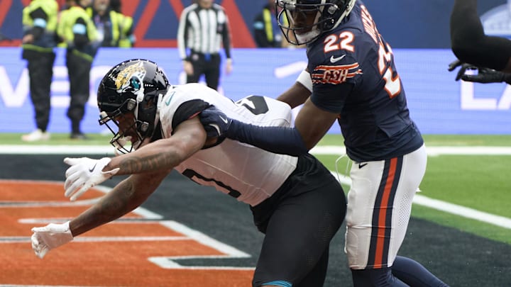 Oct 13, 2024; London, United Kingdom; Chicago Bears safety Elijah Hicks (22) breaks up a pass in the end zone for Jacksonville Jaguars wide receiver Gabe Davis (0)during an NFL International Series game at Tottenham Hotspur Stadium. 