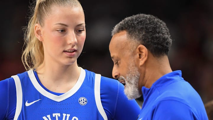 Kentucky Wildcats center Clara Strack (13) talks to Kentucky Wildcats head coach Kenny Brooks Friday, March 6, 2026, during the SEC Women's Basketball Tournament quarterfinals game against the South Carolina Gamecocks at Bon Secours Wellness Arena in Greenville, South Carolina. Kentucky Wildcats center Clara Strack (13) talks to Kentucky Wildcats head coach Kenny Brooks Friday, March 6, 2026, during the SEC Women's Basketball Tournament quarterfinals game against the South Carolina Gamecocks at Bon Secours Wellness Arena in Greenville, South Carolina.