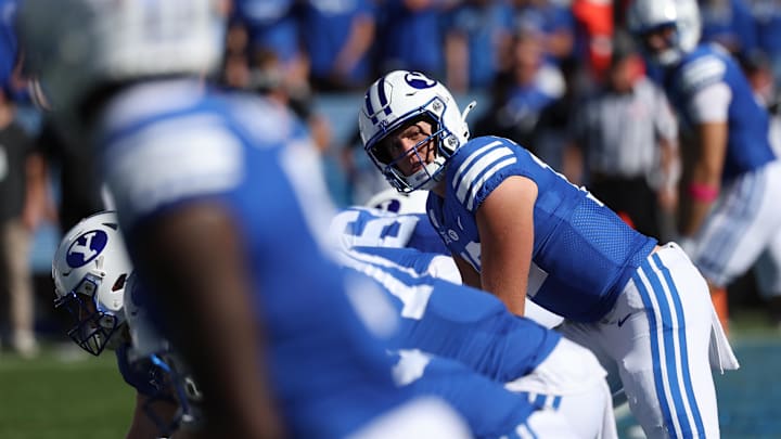 Jake Retzlaff glances down the offensive line as his BYU Cougars line up against Arizona.
