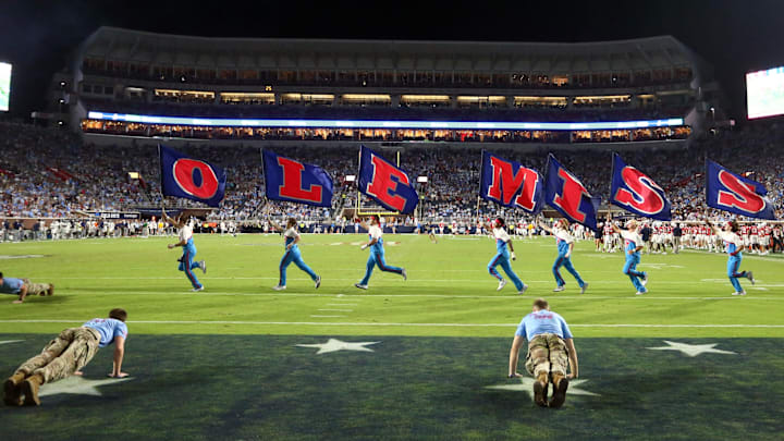 Sep 21, 2024; Oxford, Mississippi, USA; Mississippi Rebels Cheerleaders run the Ole Miss flags across the field after a touchdown during the second half against the Georgia Southern Eagles at Vaught-Hemingway Stadium. Mandatory Credit: Petre Thomas-Imagn Images Sep 21, 2024; Oxford, Mississippi, USA; Mississippi Rebels Cheerleaders run the Ole Miss flags across the field after a touchdown during the second half against the Georgia Southern Eagles at Vaught-Hemingway Stadium. Mandatory Credit: Petre Thomas-Imagn Images