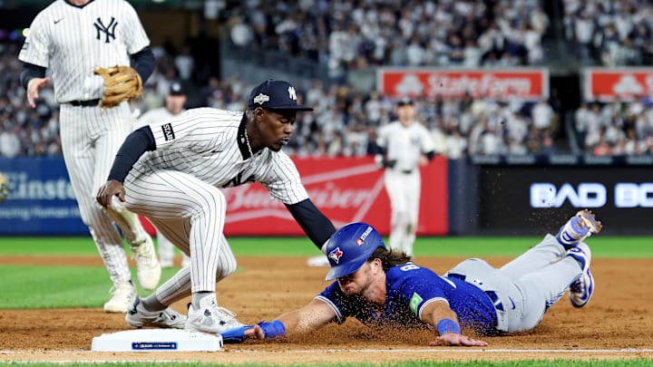 Oct 8, 2025; Bronx, New York, USA; New York Yankees second baseman Jazz Chisholm Jr. (13) tags out Toronto Blue Jays third baseman Addison Barger (47) at first base during the sixth inning during game four of the ALDS round for the 2025 MLB playoffs at Yankee Stadium. Mandatory Credit: Vincent Carchietta-Imagn Images Oct 8, 2025; Bronx, New York, USA; New York Yankees second baseman Jazz Chisholm Jr. (13) tags out Toronto Blue Jays third baseman Addison Barger (47) at first base during the sixth inning during game four of the ALDS round for the 2025 MLB playoffs at Yankee Stadium. Mandatory Credit: Vincent Carchietta-Imagn Images