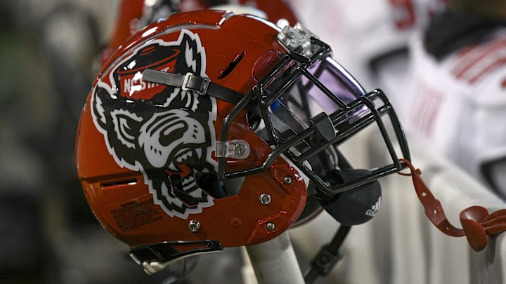 Nov 13, 2021; Winston-Salem, North Carolina, USA; A North Carolina State Wolfpack helmet seen on the sideline during the second half against the Wake Forest Demon Deacons at Truist Field. Mandatory Credit: William Howard-Imagn Images