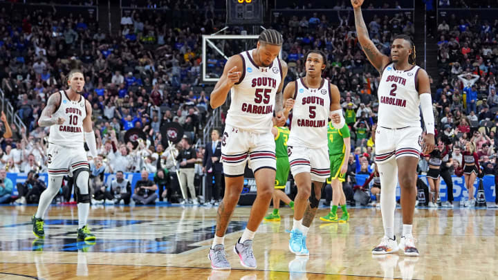 Mar 21, 2024; Pittsburgh, PA, USA; The South Carolina Gamecocks celebrate after guard Ta'Lon Cooper (55) made a last second shot before half-time of the game against the Oregon Ducks in the first round of the 2024 NCAA Tournament at PPG Paints Arena. Mandatory Credit: Gregory Fisher-USA TODAY Sports