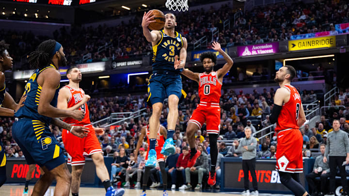 Jan 24, 2023; Indianapolis, Indiana, USA;Indiana Pacers guard Chris Duarte (3) shoots the ball while Chicago Bulls guard Coby White (0) and guard Zach LaVine (8) defend in the second quarter at Gainbridge Fieldhouse. Mandatory Credit: Trevor Ruszkowski-Imagn Images