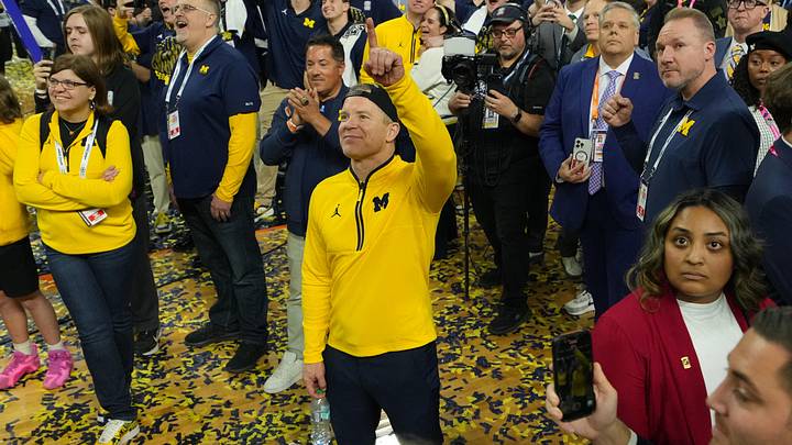 Apr 6, 2026; Indianapolis, IN, USA; Michigan Wolverines head coach Dusty May watches One Shining Moment after defeating the Connecticut Huskies in the national championship of the Final Four of the men's 2026 NCAA Tournament at Lucas Oil Stadium. Mandatory Credit: Robert Deutsch-Imagn Images