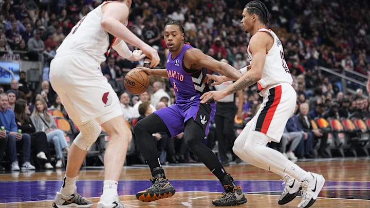 Apr 3, 2025; Toronto, Ontario, CAN; Toronto Raptors guard Scottie Barnes (4) is surrounded by Portland Trail Blazers center Donovan Clingan (23) and forward Toumani Camara (33) during the first half at Scotiabank Arena. Mandatory Credit: John E. Sokolowski-Imagn Images Apr 3, 2025; Toronto, Ontario, CAN; Toronto Raptors guard Scottie Barnes (4) is surrounded by Portland Trail Blazers center Donovan Clingan (23) and forward Toumani Camara (33) during the first half at Scotiabank Arena. Mandatory Credit: John E. Sokolowski-Imagn Images